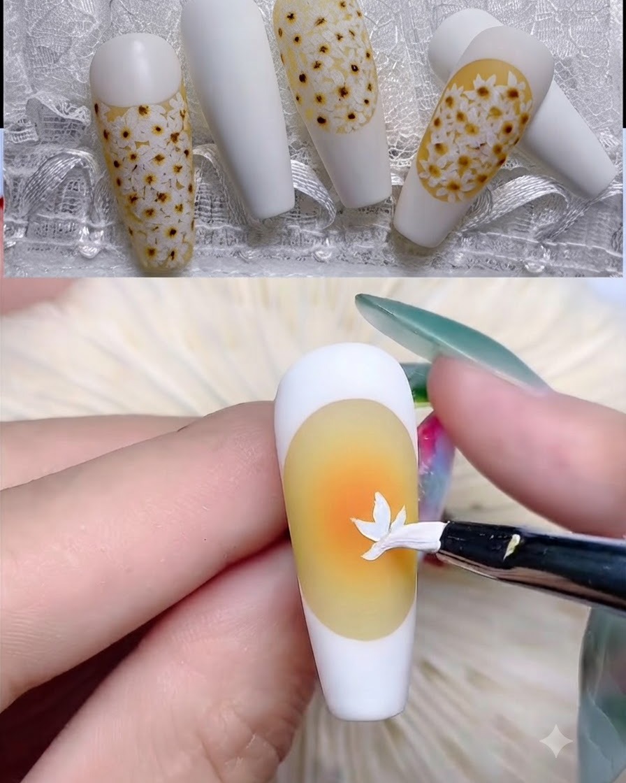 Cienki pędzelek liniowy rysujący białą krawędź french manicure na żółtym paznokciu.
