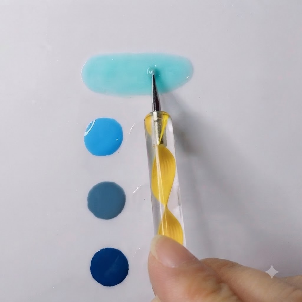 Un puntero difuminando un gel azul cielo vibrante con gel transparente en un charco alargado y suave.